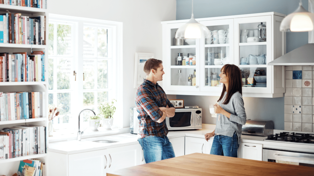 divorced couple talking about the kids schedule peacefully in the kitchen